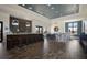 Modern clubhouse interior featuring a stylish bar area, seating, and elegant decor at 16734 Collingtree Xing, Lakewood Ranch, FL 34202