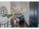 Bright foyer leading to a living room with modern furnishings and backyard view at 16734 Collingtree Xing, Lakewood Ranch, FL 34202