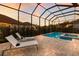 Backyard pool with brick patio, spa, and lounge chairs perfect for relaxing at 16734 Collingtree Xing, Lakewood Ranch, FL 34202