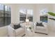 Cozy sitting area with light walls, lots of natural light, and view of pool at 16734 Collingtree Xing, Lakewood Ranch, FL 34202