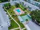 Aerial view of community pool, shuffleboard, walkways and manicured green spaces at 1815 Restful Dr # N-27, Bradenton, FL 34207