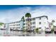Multi-story condominium building with parking area and palm trees at 1815 Restful Dr # N-27, Bradenton, FL 34207