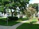 Lush community grounds with mature trees and walkways offer a serene atmosphere at 1815 Restful Dr # N-27, Bradenton, FL 34207