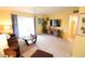 Bright living room with comfortable sofa, flat screen tv, and access to the outdoors at 1815 Restful Dr # N-27, Bradenton, FL 34207