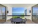 A waterfront balcony featuring outdoor seating and panoramic water views at 2020 Harbourside Dr # 454, Longboat Key, FL 34228