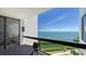Condo balcony featuring seating and stunning panoramic views of the bay and coastline at 2020 Harbourside Dr # 454, Longboat Key, FL 34228