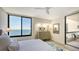 Relaxing bedroom boasts beautiful ocean views and a private balcony access at 2020 Harbourside Dr # 454, Longboat Key, FL 34228