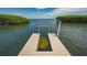 Private dock featuring an opening for natural light to penetrate the water at 2020 Harbourside Dr # 454, Longboat Key, FL 34228