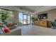 Inviting lobby area with comfortable wicker seating, plants, and large glass doors to the pool at 2020 Harbourside Dr # 454, Longboat Key, FL 34228