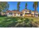 Spacious backyard featuring a well-maintained lawn and fenced perimeter, ideal for outdoor living at 206 Elliot Ave # 137, Sarasota, FL 34232
