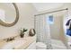 Well-lit bathroom with a tiled shower and a vanity with countertop space at 206 Elliot Ave # 137, Sarasota, FL 34232