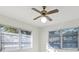 Bright bedroom with natural light from multiple windows and a ceiling fan at 206 Elliot Ave # 137, Sarasota, FL 34232