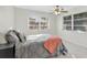 Cozy bedroom filled with natural light from multiple windows, with a ceiling fan above at 206 Elliot Ave # 137, Sarasota, FL 34232