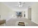 Open-concept dining area featuring a wooden table, three chairs, carpet, and natural light through sliding glass doors at 206 Elliot Ave # 137, Sarasota, FL 34232