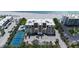 Stunning aerial view of beachside condos with tennis courts, swimming pools, beach access and ample parking at 2675 Gulf Of Mexico Dr # 403, Longboat Key, FL 34228