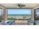 Relax on this balcony featuring stunning ocean views and comfortable seating under a cooling ceiling fan at 2675 Gulf Of Mexico Dr # 403, Longboat Key, FL 34228