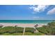 Breathtaking ocean views with manicured beach access, perfect for a tranquil coastal living experience at 2675 Gulf Of Mexico Dr # 403, Longboat Key, FL 34228
