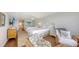Bright bedroom featuring two queen beds, with access to bathroom and seating area at 2675 Gulf Of Mexico Dr # 403, Longboat Key, FL 34228