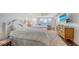 Bright bedroom featuring two queen beds, a ceiling fan and an ocean view at 2675 Gulf Of Mexico Dr # 403, Longboat Key, FL 34228
