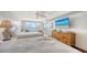 Bright bedroom featuring two queen beds, a ceiling fan, balcony and an ocean view at 2675 Gulf Of Mexico Dr # 403, Longboat Key, FL 34228