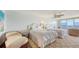 Bright bedroom featuring two queen beds, ceiling fan and an ocean view at 2675 Gulf Of Mexico Dr # 403, Longboat Key, FL 34228