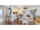 Inviting dining room with an open kitchen, perfect for modern living and entertaining guests at 2675 Gulf Of Mexico Dr # 403, Longboat Key, FL 34228
