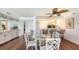 Stylish dining room with a glass table and open access to the kitchen and bar area at 2675 Gulf Of Mexico Dr # 403, Longboat Key, FL 34228