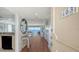 Condo entryway with shell-themed decor, hardwood floors, and an ocean view at 2675 Gulf Of Mexico Dr # 403, Longboat Key, FL 34228