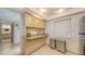 Kitchen showcasing generous cabinet space and granite countertops, with tile flooring and stainless steel bins at 2675 Gulf Of Mexico Dr # 403, Longboat Key, FL 34228