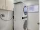 Efficient laundry area with stacked washer and dryer, maximizing space and convenience at 2675 Gulf Of Mexico Dr # 403, Longboat Key, FL 34228
