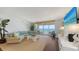 Living room featuring hardwood floors, a sectional sofa, and ocean view at 2675 Gulf Of Mexico Dr # 403, Longboat Key, FL 34228