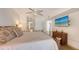 The spacious bedroom features a bamboo bed frame, a TV, and access to a private bathroom at 2675 Gulf Of Mexico Dr # 403, Longboat Key, FL 34228
