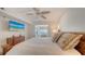Spacious main bedroom with TV, bamboo furniture and adjacent sitting room with ocean view at 2675 Gulf Of Mexico Dr # 403, Longboat Key, FL 34228