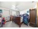 Well-lit bedroom with ceiling fan, carpet floors, and a full-sized sleigh bed at 270 E Langsner St, Englewood, FL 34223