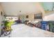 A large, covered carport features room for multiple cars and patio set at 270 E Langsner St, Englewood, FL 34223
