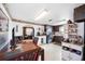 A quaint kitchen and dining area with dark cabinets and stainless steel appliances at 270 E Langsner St, Englewood, FL 34223
