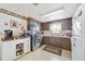 Kitchen featuring stainless appliances, wood cabinets and tile flooring at 270 E Langsner St, Englewood, FL 34223