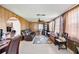 Cozy Gathering room with paneled walls, a ceiling fan, and comfortable seating at 270 E Langsner St, Englewood, FL 34223