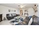 Bright living room with light-colored walls, ceiling fan, and contemporary furnishings at 270 E Langsner St, Englewood, FL 34223