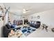 Bright living room with light-colored walls, ceiling fan, and contemporary furnishings at 270 E Langsner St, Englewood, FL 34223