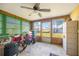 Versatile sunroom with multiple windows offering natural light and views of the backyard at 270 E Langsner St, Englewood, FL 34223