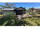 Well-maintained backyard with a patio, lush lawn, and charming details, perfect for outdoor enjoyment at 2816 N Lockwood Meadows Blvd, Sarasota, FL 34234