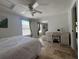 Relaxing bedroom with tile flooring, a ceiling fan, and a mirrored closet providing depth to the space at 2816 N Lockwood Meadows Blvd, Sarasota, FL 34234