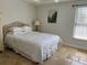 Cozy bedroom features a comfortable bed, natural lighting, and stylish decor at 2816 N Lockwood Meadows Blvd, Sarasota, FL 34234