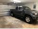 Spacious garage interior with a parked truck, showcasing ample parking and storage capabilities at 2816 N Lockwood Meadows Blvd, Sarasota, FL 34234