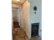 Hallway featuring tile floors, a beverage cooler, and closet space, offering convenience and ample storage at 2816 N Lockwood Meadows Blvd, Sarasota, FL 34234