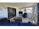 Inviting lanai with comfortable seating, a TV, and natural light, perfect for relaxation and entertaining at 2816 N Lockwood Meadows Blvd, Sarasota, FL 34234