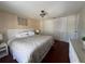 Bright main bedroom featuring hardwood floors, a queen bed, ample closet space, and natural light at 2816 N Lockwood Meadows Blvd, Sarasota, FL 34234