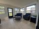 Bright sunroom with comfortable seating and ample natural light at 2816 N Lockwood Meadows Blvd, Sarasota, FL 34234