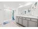 Spacious bathroom featuring a large vanity with double sinks and a tiled stand up shower at 3027 Great Abaco Way, Bradenton, FL 34208